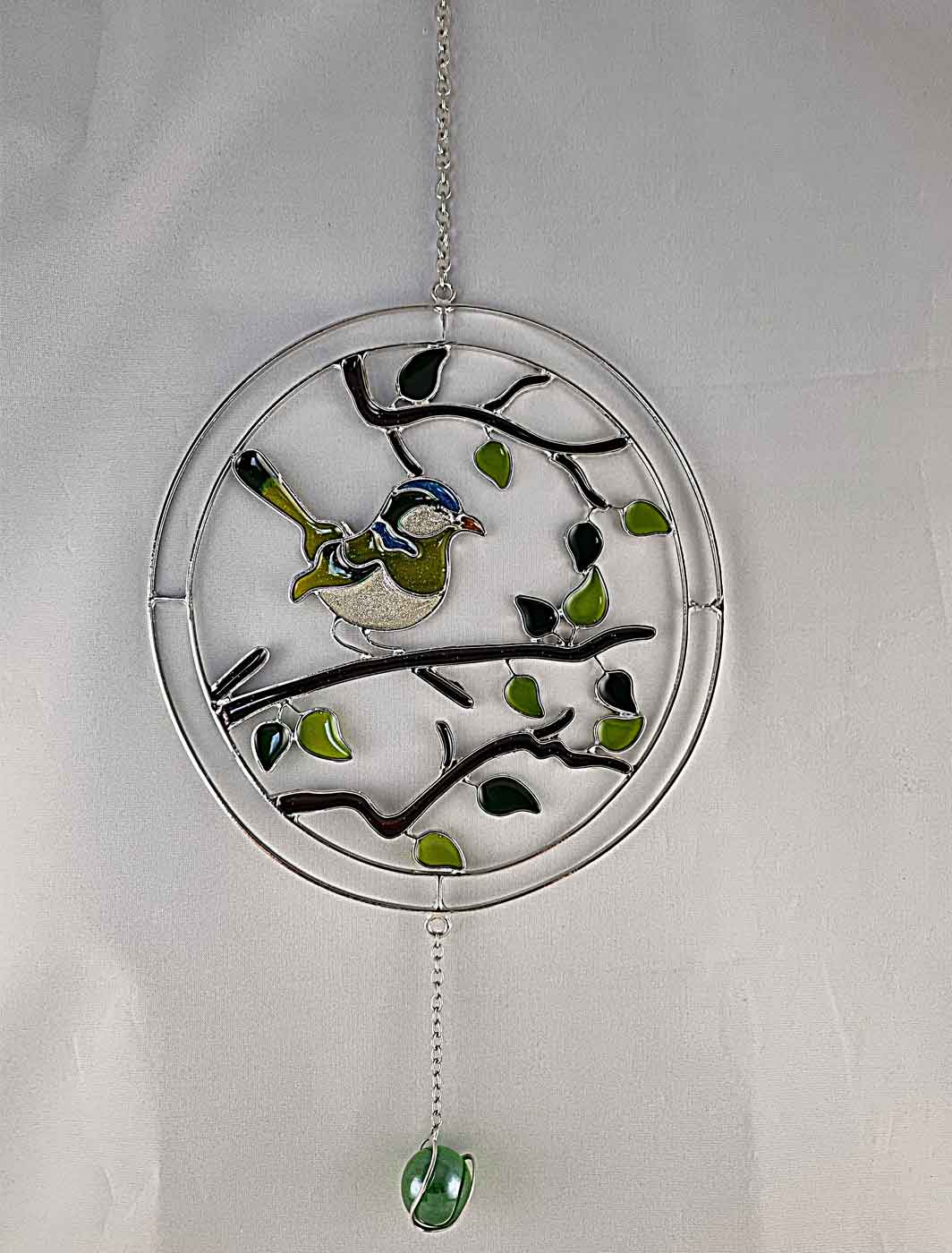 Kreis mit Vogel grün